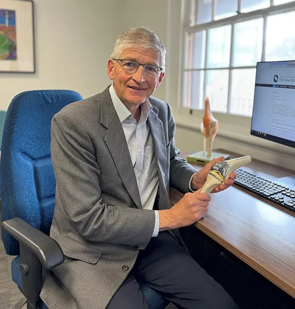 Orthopaedic specialist seated in a consulting room