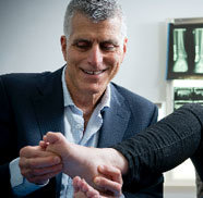 Dr George Dracopoulos inspecting a foot injury - Orthopaedics SA
